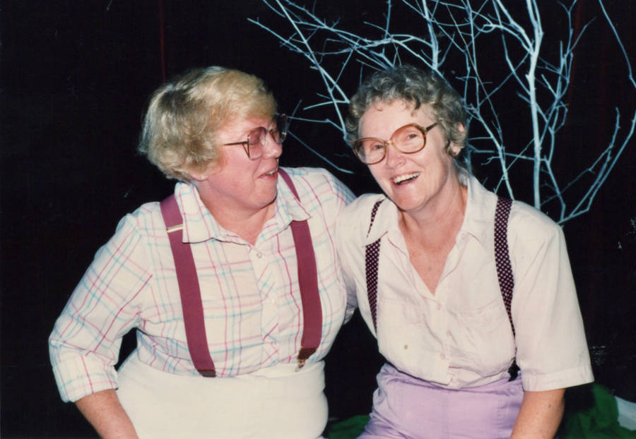 Mary Alice Stout and Ellen Spangler with one arm around each other, Mary Alice looking at Ellen, Ellen at the camera