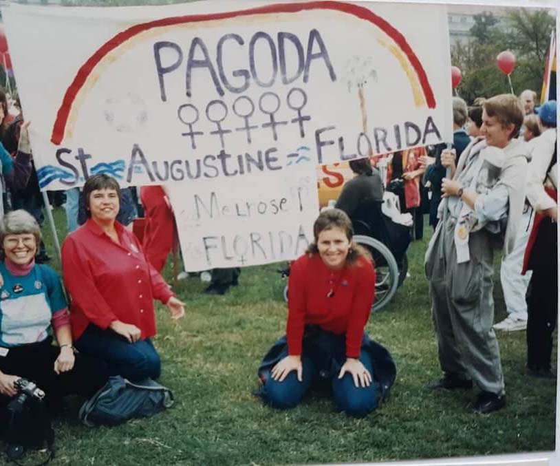 left to right Emily Greene, Corky Culver, Morgana MacVicar, and Shan Chaney hold banner that says Pagoda, over women symbols
