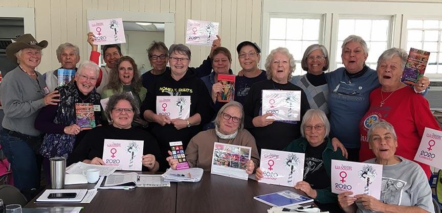 Seventeen women holding calendars and books