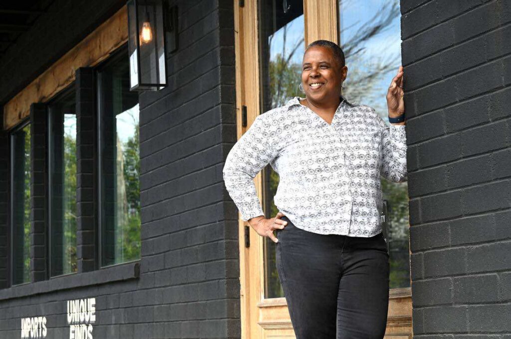 Diana Ward standing in front of building.