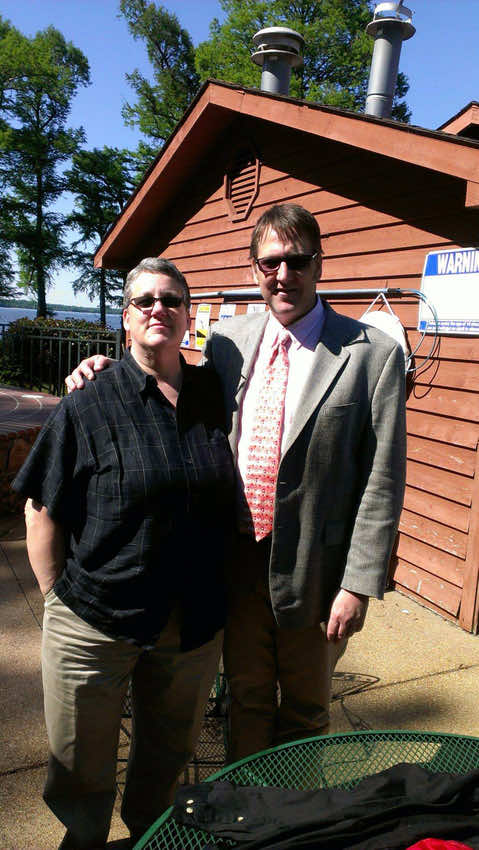 Lenny Lasater left and brother Kevin right circa 2000 stand in front of garage