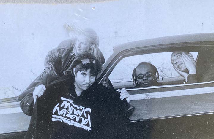 Jaen Black wearing a Moral Hazard t-shirt with three boy band members