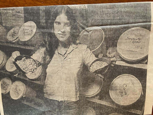 Marie Steinwachs holds up scoops filled with grains