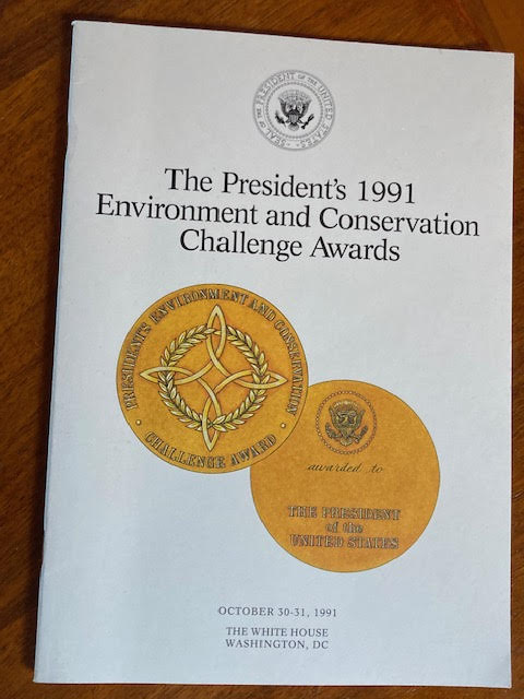 A white document with the US President's seal ad two other seals