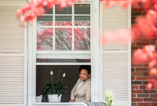 Kecia Cunningham sits in open window.