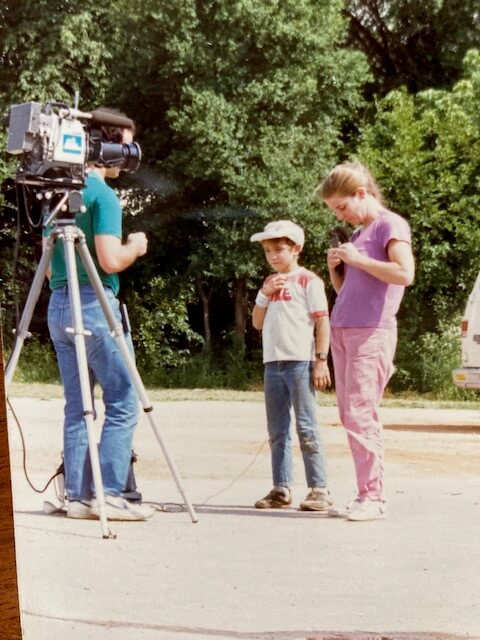 Marie Steinwachs and a male child in front of TV camera