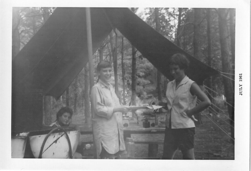 Corky Culver center as a young girl scout with an unidentified woman on left and one on right