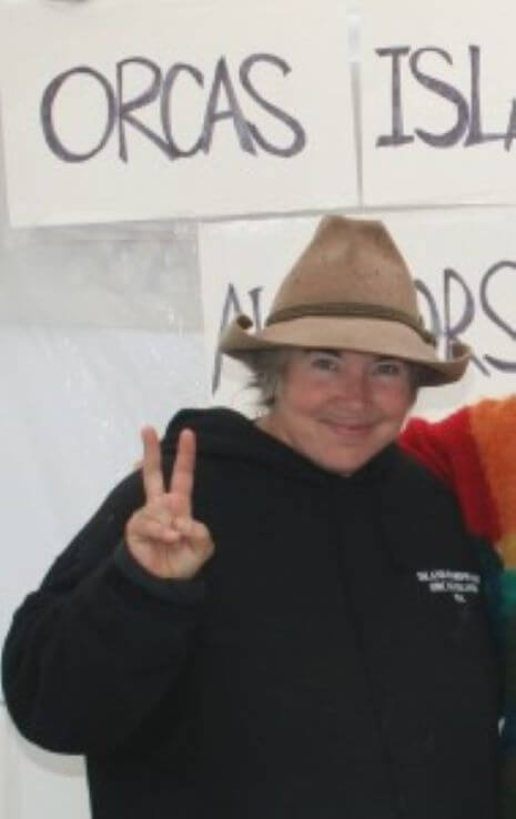 Jaen Black and sign above her says Orcas Isle