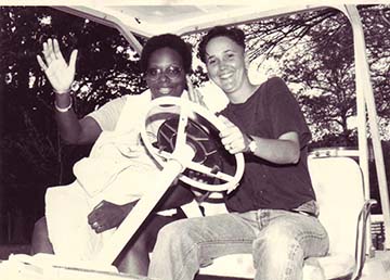 Mandy Carter and Barbara Savage in a golf cart