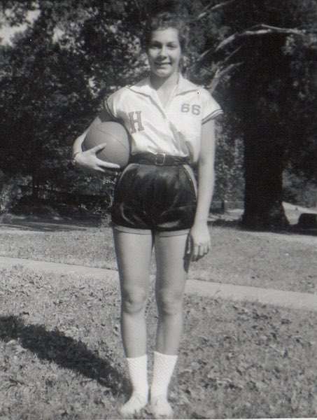 Young Leaf in shorts holding a basketball