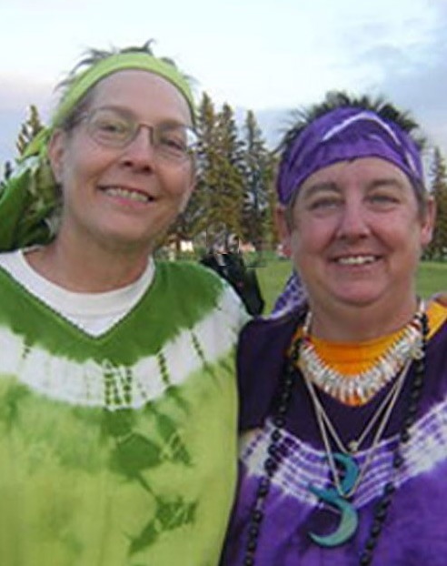 Leaf and Drea in festive tie dyed costumes