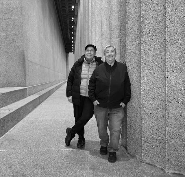 Leaf and Drea leaning on a wall