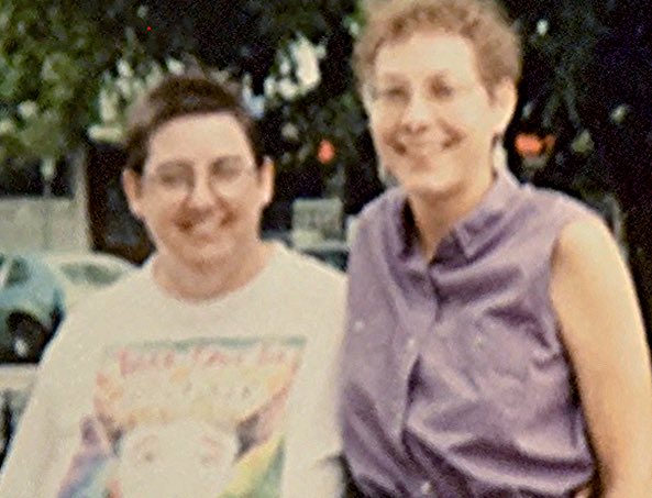 Younger Leaf and Drea in front of Womontown house