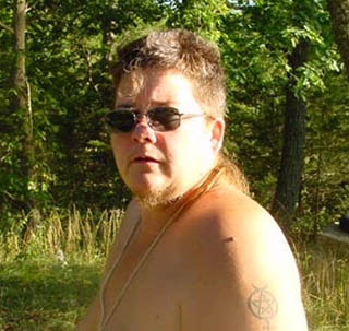 Cherry Omega wearing sunglasses topless