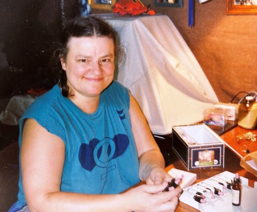 Jes Ryn with bottles of her herbs