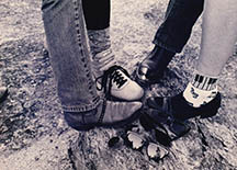 band members each have a foot toe to toe in this photo