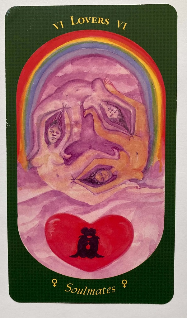 The card shows three nude figures forming an ouroboros under a rainbow and above a heart with two twined figures in profile